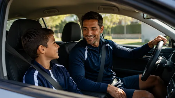 Parent and child talking in the car after a game